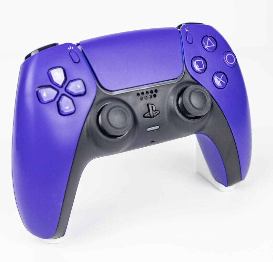 A black PS5 DualSense controller angled to show the analogue sticks and face buttons