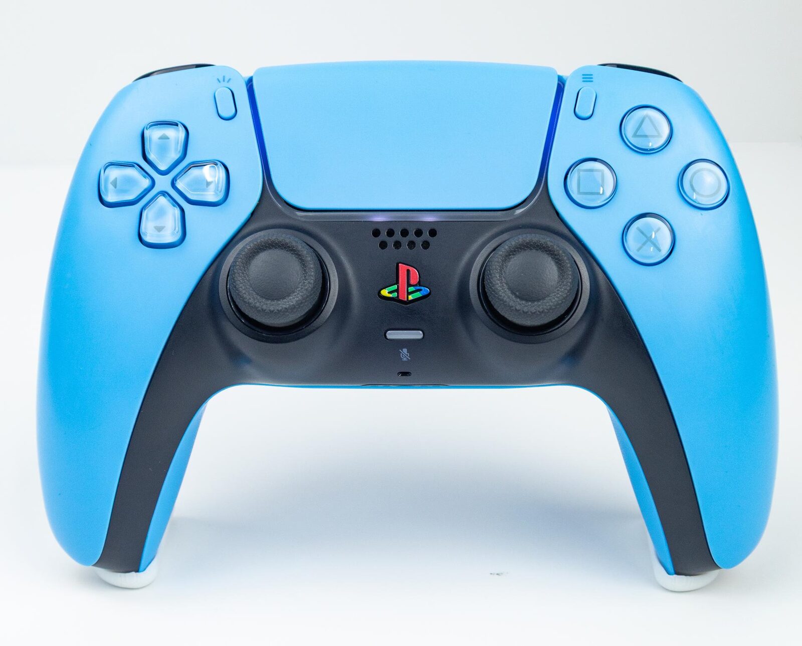 A standard PS5 DualSense controller photographed from the front