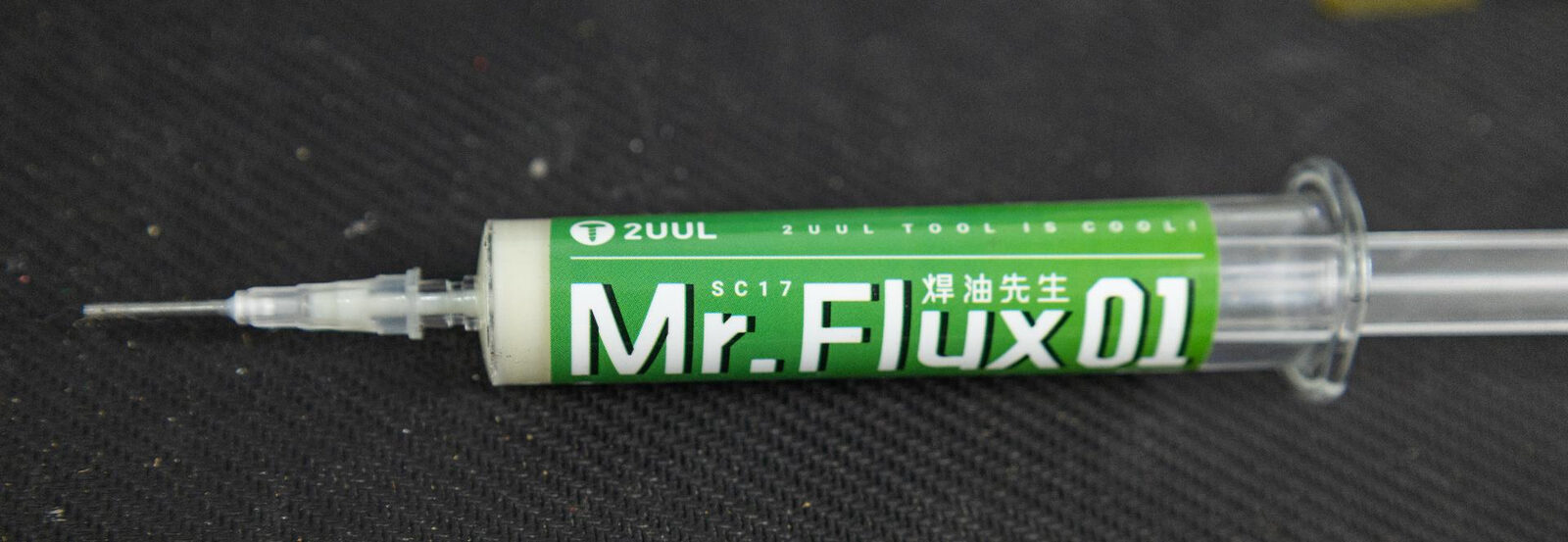 A syringe of 2UUL Mr.Flux 01 tacky flux paste with a fine dispensing needle