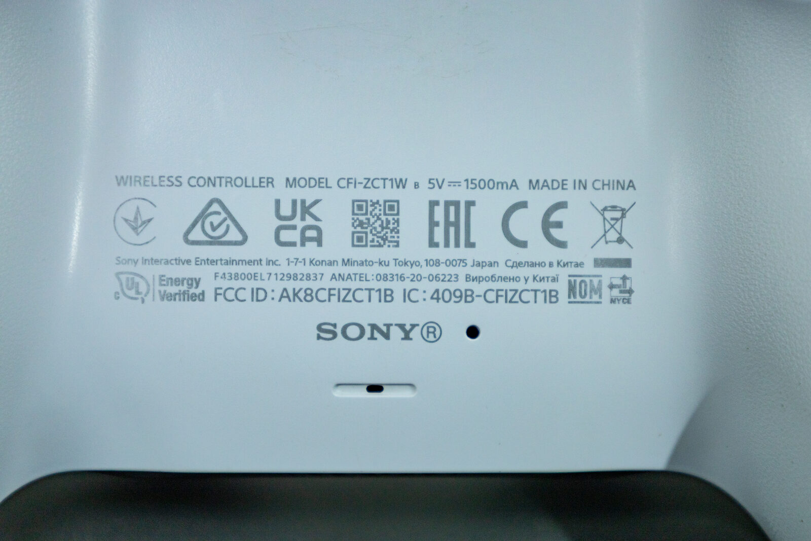 The rear label of a PS5 DualSense controller showing model number CFI-ZCT1W and regulatory markings
